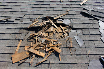 Roof Damaged in Storm Getting Repaired